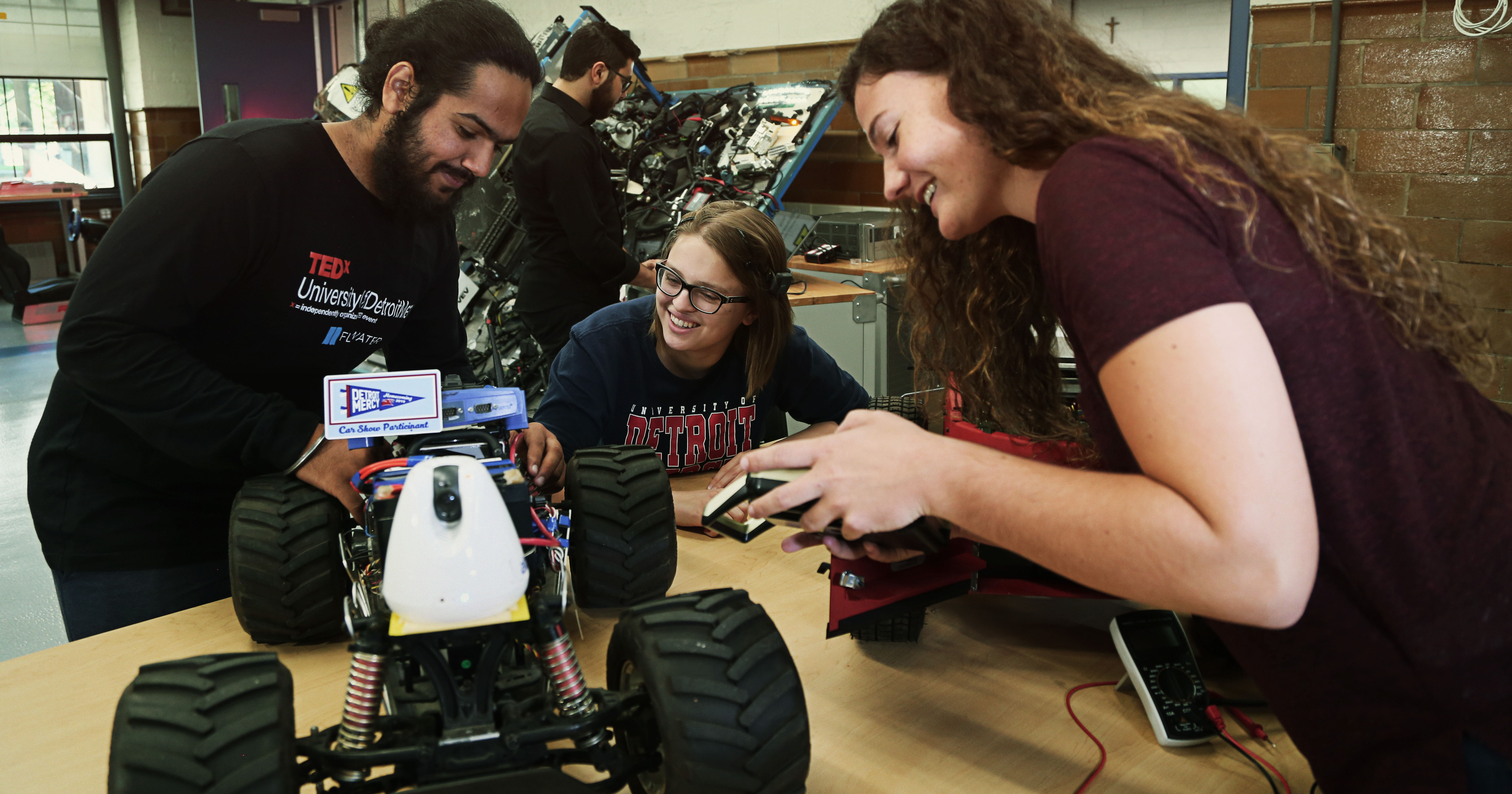 Engineering students work on an autonomous vehicle.