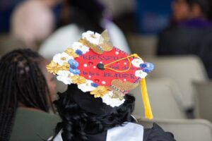 A graduation cap is decorated and reads, Blessed that God chose me to be a Leader.