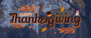 A Happy Thanksgiving graphic, featuring Tommy Titan, leaves, branches and a pilgrim's hat. The blue-tinted photo behind includes an outdoor capture of the McNichols Campus with buildings, lamp posts, colorful trees and a clock tower pictured.