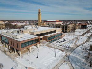 A snowy aerial photo of the McNichols Campus, showcasing the Student Union, clock tower and other buildings.