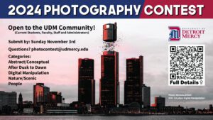 A graphic introducing the 2nd Annual UDM Photography Contest, which is open to the UDM community. Submissions are due on Nov. 3. The background photo is the 2023 prize winner in digital manipulation category of Nicholas D'Asti. There is also a scan code for more information on the contest and submission details.