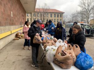 TENN Student Leaders and volunteers packing bags of fresh produce for 60 families in the Martin Park Neighborhood.