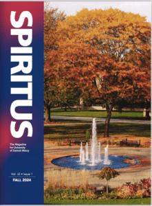 The cover of the fall 2024 issue of Spiritus magazine, the magazine for University of Detroit Mercy, Vol. 33, Issue 1. A photo on the cover is of the new fountain under a canopy of trees with brilliant fall colors.