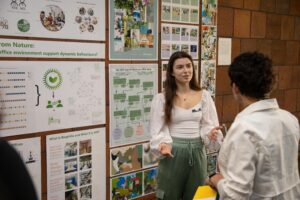 A student presents in the Student Union during the 2024 Scholarly Celebration of Achievement.