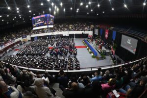 An overhead photo of graduates and guests inside of Calihan Hall during 2024 Commencement.