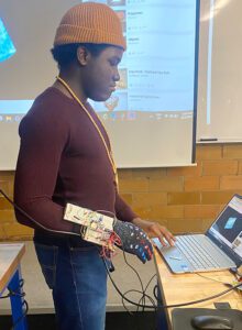 Agholor works on a computer inside of a classroom setting.