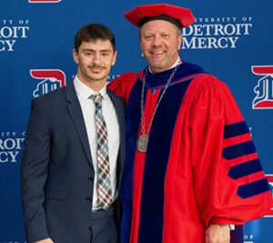 Mark Formosa poses for a photo with President Taylor.