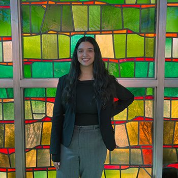Cristal Guzman poses for a picture in the Gardella Honors House