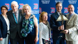 Spotlight on Excellence 2025, featuring six people in two photos posing for awards and honors.