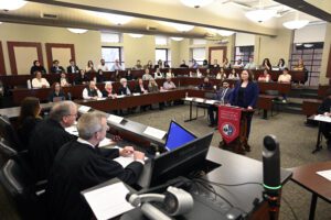 UDM students arguing in a courtroom at moot court competition.