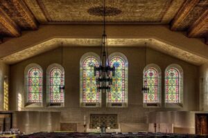 Image of inside of Gesu church with stained glass windows