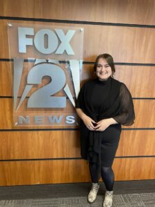 Liberty Brooke Stevens standing before Fox 2 News sign