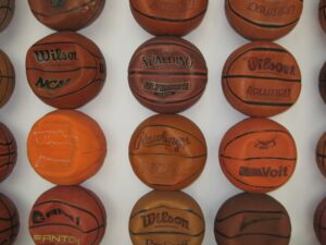 An image of multiple Wilson basketballs lined up in rows