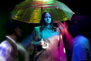 Image of a woman holding an umbrella